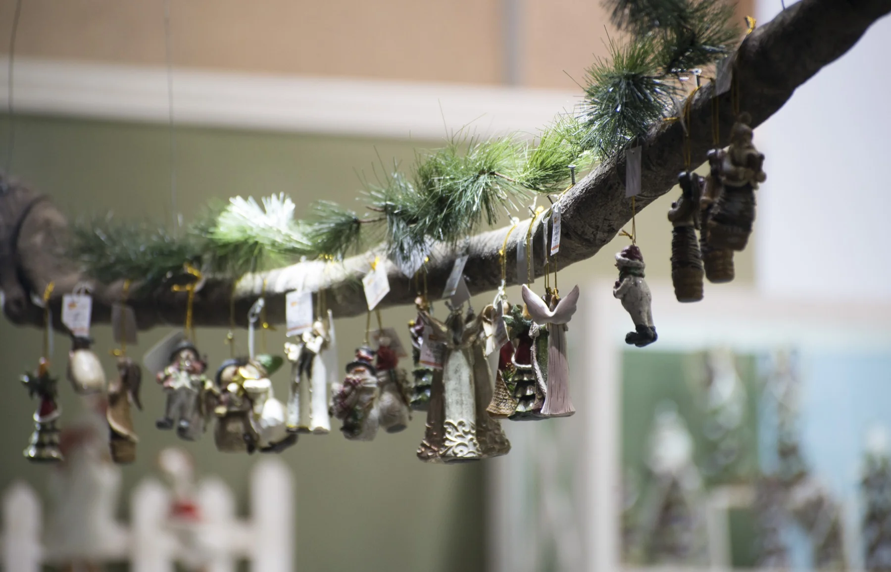 Showroom ornaments hanging from a decorated branch